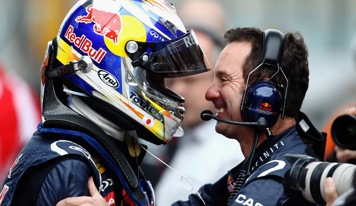 Race engineer and driver working together in the pits
